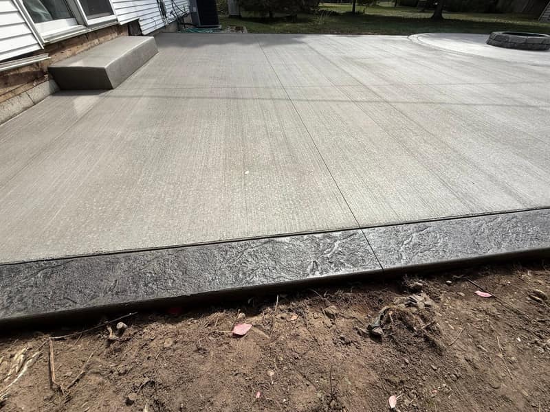 Brushed concrete slab framed with a stamped border