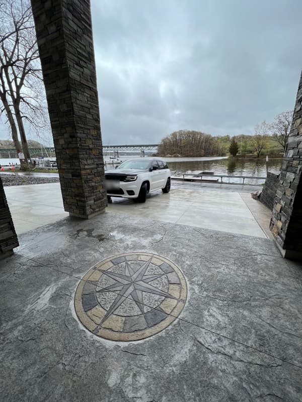 Compass medallion stamped into a waterfront concrete surface
